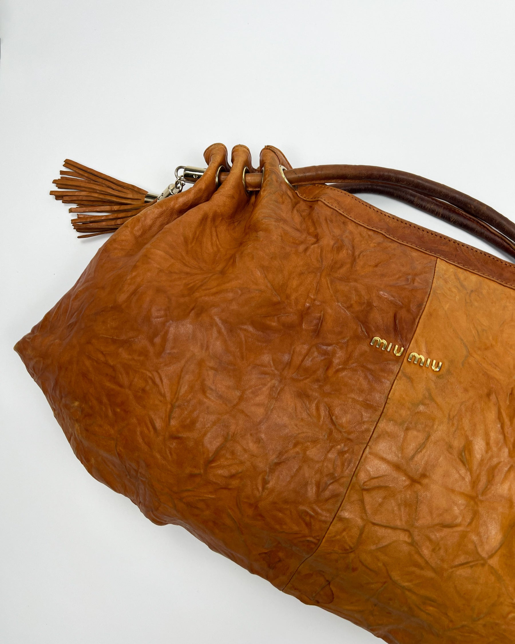 00's Miu Miu Leather Hobo Bag with Tassels in Tan